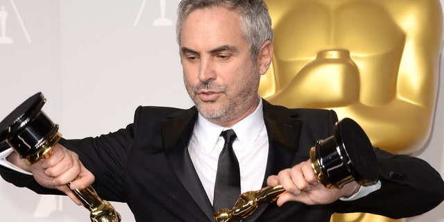 HOLLYWOOD, CA - MARCH 02: Director Alfonso Cuarón, winner of Best Achievement in Directing poses in the press room during the Oscars at Loews Hollywood Hotel on March 2, 2014 in Hollywood, California. (Photo by Jason Merritt/Getty Images)