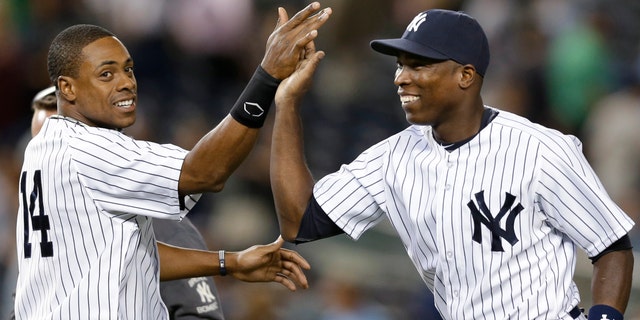 New York Yankees right fielder Curtis Granderson, left, congratulates left fielder Alfonso Soriano. (AP Photo/Kathy Willens)