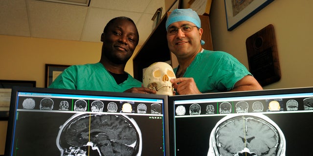 Kofi Boahene, M.D., left, and Alfredo Quinones-Hinojosa, M.D. in a 2010 file photo.