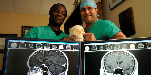 Kofi Boahene, M.D., left, and Alfredo Quinones-Hinojosa, M.D. in a 2010 file photo.