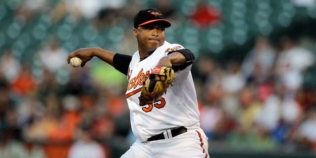 BALTIMORE, MD - JULY 16: Starting pitcher Alfredo Simon #55 of the Baltimore Orioles delivers to a Cleveland Indians batter at Oriole Park at Camden Yards on July 16, 2011 in Baltimore, Maryland. (Photo by Rob Carr/Getty Images)