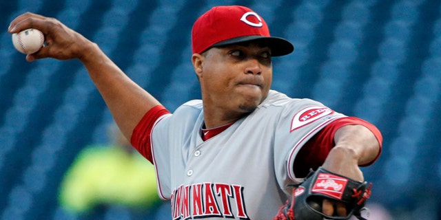Cincinnati Reds starting pitcher Alfredo Simon delivers during the first inning of a baseball game against the Pittsburgh Pirates in Pittsburgh on Wednesday, April 23, 2014. (AP Photo/Gene J. Puskar)