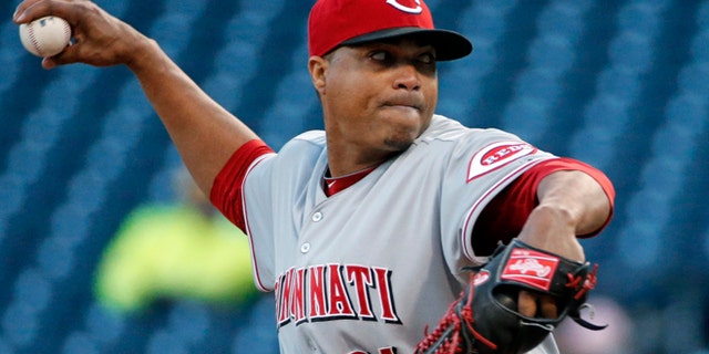 Cincinnati Reds starting pitcher Alfredo Simon delivers during the first inning of a baseball game against the Pittsburgh Pirates in Pittsburgh on Wednesday, April 23, 2014. (AP Photo/Gene J. Puskar)