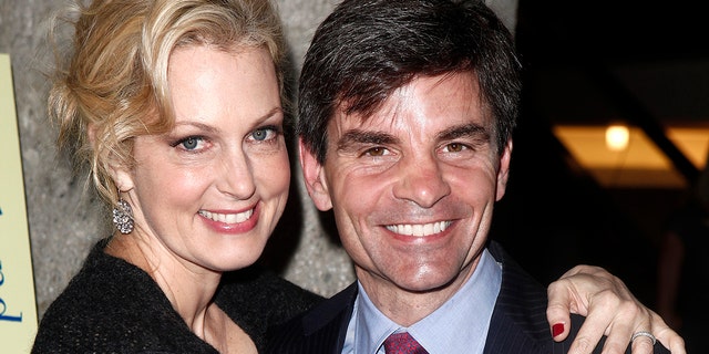 Actress and author Ali Wentworth poses with her husband George Stephanopoulos at her "Ali In Wonderland: And Other Tall Tales" book launch at Sotheby's in New York February 6, 2012.