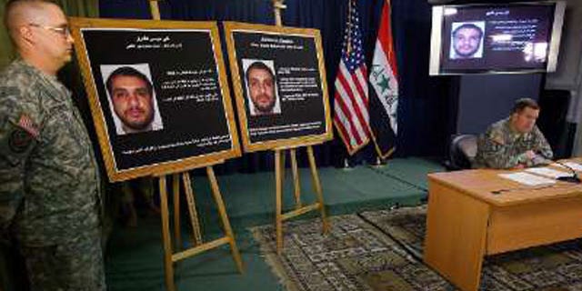 Brigadier-General Kevin J. Bergner, U.S. military spokesman in Iraq, speaks to the media next to a picture of Ali Mussa Daqduq, a captured senior Lebanese Hezbollah operative, at the heavily fortified Green Zone area in Baghdad July 2, 2007.
