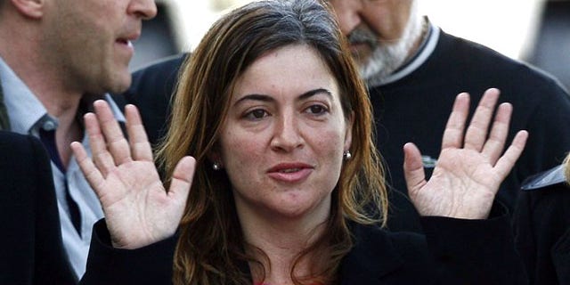 Alicia Gamez gestures during her arrival at Barcelona's airport March 10, 2010. Gamez, who was held hostage in Mali by a group believed to be al Qaeda's wing in North Africa, has been freed, the Spanish government said on Wednesday. Aid-worker Gamez was part of an aid convoy travelling to southern Senegal when she was seized in northern Mauritania in November along with two Spanish colleagues Albert Vilalta and Roque Pascual.
