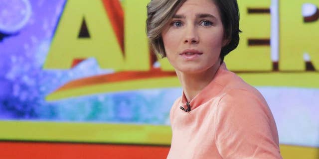 FILE - In this Jan. 31, 2014, file photo, Amanda Knox prepares to leave the set following a television interview in New York. Knox is engaged to Colin Sutherland, a musician who recently moved to Seattle from New York, a person close to the Knox family confirmed for The Associated Press. Knox’s murder conviction in the 2007 stabbing of her roommate has been reinstated by an Italian court, but the former college exchange student maintains her innocence and vows she won’t willingly go back to Italy. Both Knox and Sutherland are 27. No wedding date had been set. (AP Photo/Mark Lennihan, File)