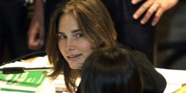 September 29: Amanda Knox looks on as she sits next to her lawyer Maria Del Grosso at the Perugia court, central Italy.