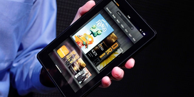 The original Kindle Fire is introduced at a news conference in New York on Sept. 28, 2011. Amazon.com quenched the Kindle Fire on Aug. 30, 2012, saying its first tablet computer is now sold out. The Internet retailer is widely expected to reveal a new model of the Fire Thursday.