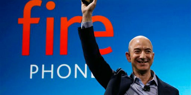 Amazon CEO Jeff Bezos introduces the new Amazon Fire Phone, Wednesday, June 18, 2014, in Seattle. (AP Photo/Ted S. Warren)
