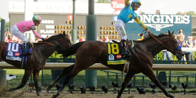 Victor Espinoza rides American Pharoah to victory in the 141st running of the Kentucky Derby horse race at Churchill Downs Saturday, May 2, 2015, in Louisville, Ky. (AP Photo/Morry Gash)