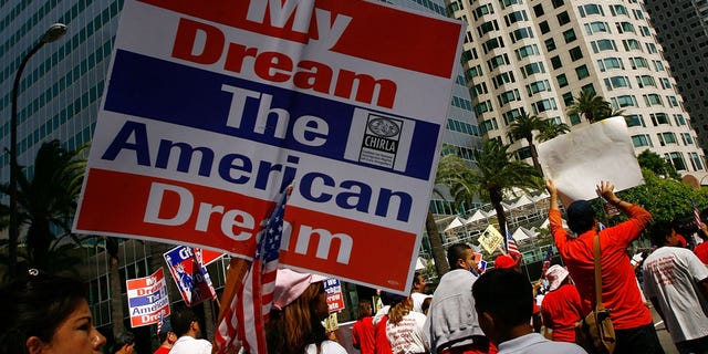 LOS ANGELES, CA - MAY 01: Demonstrators from three separate immigrants' rights marches converge for a massive May Day rally on May 1, 2008 in Los Angeles, California. Thousands are expected to turn out for the International Workers Day immigration-rights marches and rally. In 2007, some people threw their water bottles at police. Riot police reacted by forcing thousands of people from Macarthur Park, beating and shooting rubber bullets at marchers and journalists. The LAPD has been briefing their officers to prevent a replay of the so-called "May Day Malay". (Photo by David McNew/Getty Images)