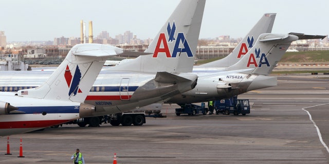 April 16, 2013: American Airlines aircraft sit on the tarmac at LaGuardia airport following a reservation system outage in New York.
