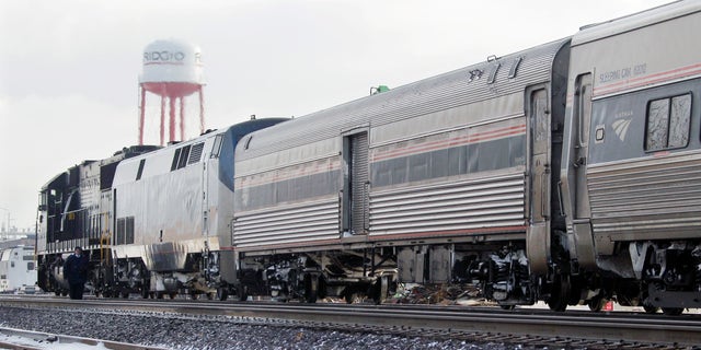 Dec. 15: A Norfolk and Southern engine hooked to an Amtrak passenger train waits on a siding in Elyria, Ohio. The lead engine of the Chicago-to-New York Lake Shore Limited Amtrak train caught fire earlier in the morning forcing evacuation of 128 passengers and three train crew.