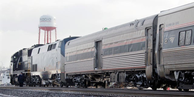 Dec. 15: A Norfolk and Southern engine hooked to an Amtrak passenger train waits on a siding in Elyria, Ohio. The lead engine of the Chicago-to-New York Lake Shore Limited Amtrak train caught fire earlier in the morning forcing evacuation of 128 passengers and three train crew.