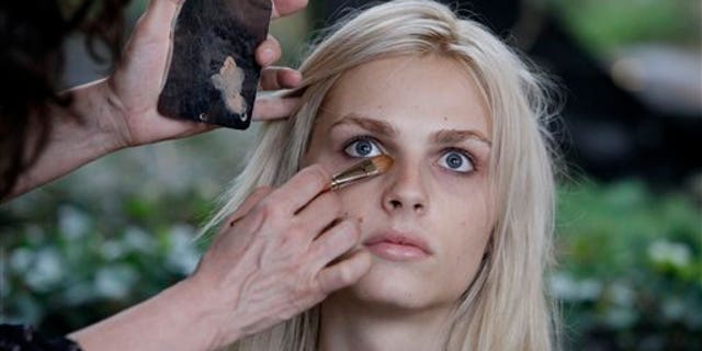 In this Jan. 27, 2012 photo, photographer transgender model Andrej Pejic has make-up applied by Cecelia Romero for a fashion shoot in New York. Transgender models have promoted the work of Marc Jacobs and Jean Paul Gaultier, but its a man with no plans for gender reassignment surgery whos straddling the line like no other. Pejic, 20, says hes perfectly happy being gender neutral. Some in the fashion industry see Pejic as a sign of a new gender fluidity. (AP Photo/Richard Drew)