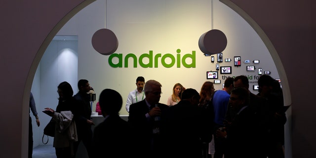 File photo - People visit an Android stand at the Mobile World Congress in Barcelona March 4, 2015.
