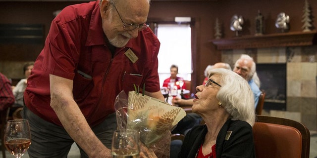 Andy Carver continued his tradition of handing out a bouquet of flowers several months after he moved into the Lakeline Oaks Retirement Resort in Cedar Park, Texas. He does it to honor his wife's memory.