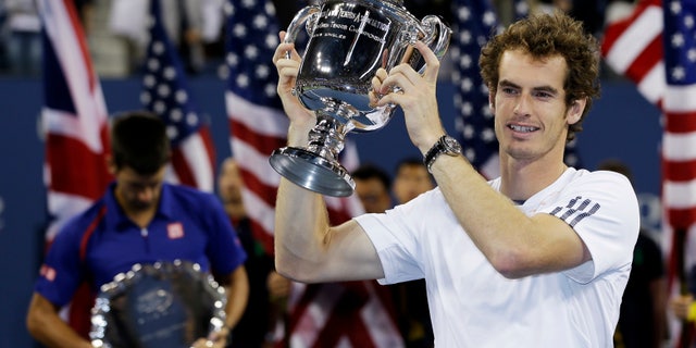 Britain's Andy Murray poses with the trophy after defeating Serbia's Novak Djokovic in the championship match at the U.S. Open tennis tournament, Monday, Sept. 10, 2012, in New York. Murray won 7-6 (10), 7-5, 2-6, 3-6, 6-2. (AP Photo/Mike Groll)