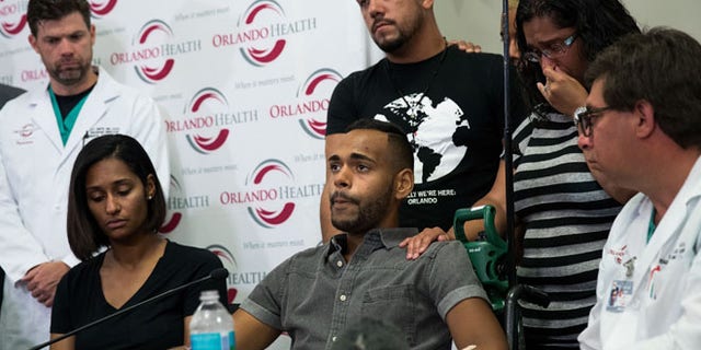 ORLANDO, FL - JUNE 14: Surrounded by medical personnel and his siblings, Angel Colon, who was injured in the Pulse Nightclub shooting, speaks to the media during a press conference at Orlando Regional Medical Center, June 14, 2016 in Orlando, Florida. The shooting at Pulse Nightclub, which killed 49 people and injured 53, is the worst mass-shooting event in American history. (Photo by Drew Angerer/Getty Images)