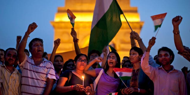 August 17: Supporters of India's most prominent anti-corruption crusader Anna Hazare gather in a show of solidarity near the India Gate memorial in New Delhi, India. Police arrested Hazare on Tuesday to scuttle his plans to hold a public fast and tried to free him hours later. However, Hazare refused to leave the jail unless he was granted permission to hold a public demonstration aimed at forcing lawmakers to strengthen a draft bill that would create an anti-corruption ombudsman.