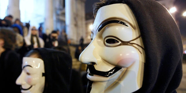 Jan. 28, 2012: A protester wearing a Guy Fawkes mask, symbolic of the hacktivist group "Anonymous", takes part in a protest in central Brussels.
