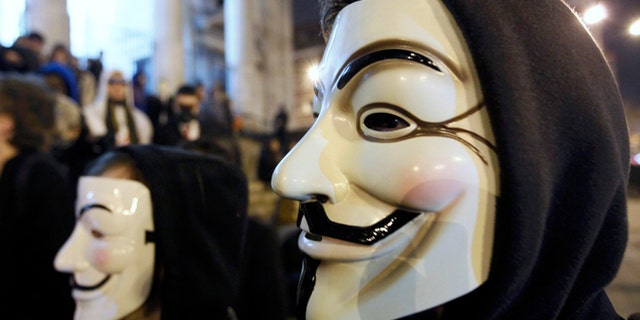 Jan. 28, 2012: A protester wearing a Guy Fawkes mask, symbolic of the hacktivist group "Anonymous", takes part in a protest in central Brussels.