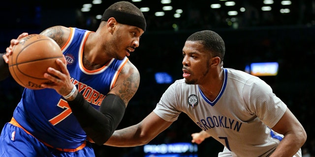 Brooklyn Nets' Joe Johnson and Carmelo Anthony during an NBA game Friday, Feb. 6, 2015, in New York.