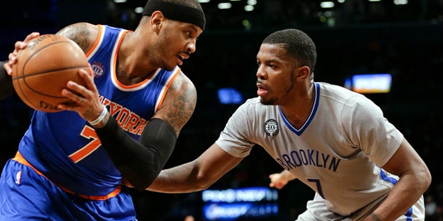 Brooklyn Nets' Joe Johnson and Carmelo Anthony during an NBA game Friday, Feb. 6, 2015, in New York.