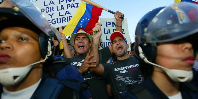 CARACAS - VENEZUELA -DECEMBER 17: Opponents of Venezuelan President Hugo Chavez clash with police.