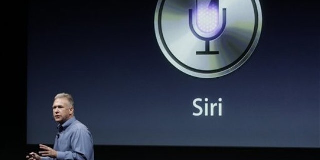 Oct. 4, 2011: Apple's Phil Schiller talks about Siri with the new Apple iPhone 4S during an announcement at Apple headquarters in Cupertino, Calif.