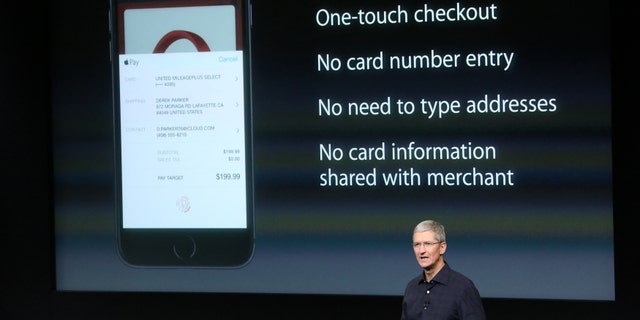 Apple CEO Tim Cook speaks about the Apple Pay service during a presentation at Apple headquarters.
