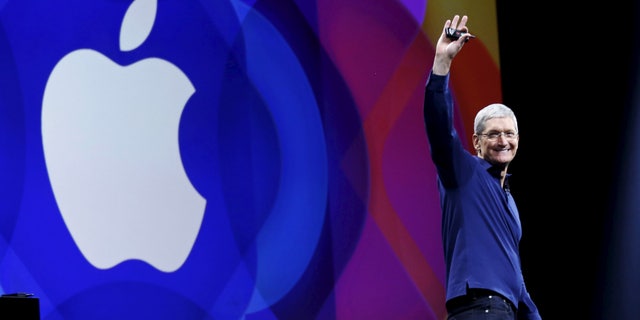 Apple CEO Tim Cook waves as he arrives on stage to deliver his keynote address at the Worldwide Developers Conference in San Francisco, Calif., June 8, 2015.
