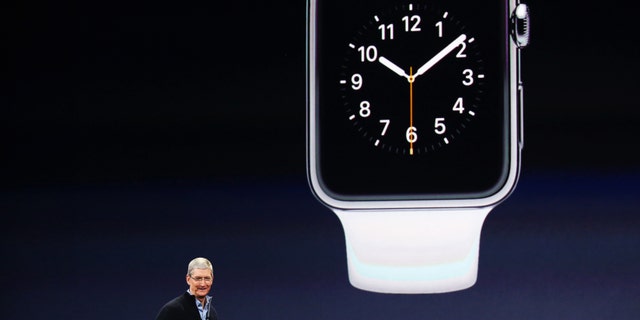Apple CEO Tim Cook introduces the Apple Watch during an Apple event in San Francisco, California March 9, 2015.