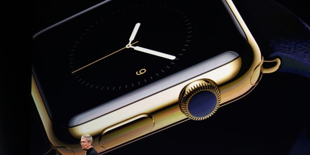 Apple CEO Tim Cook introduces the Apple Watch during an Apple event in San Francisco, California March 9, 2015.