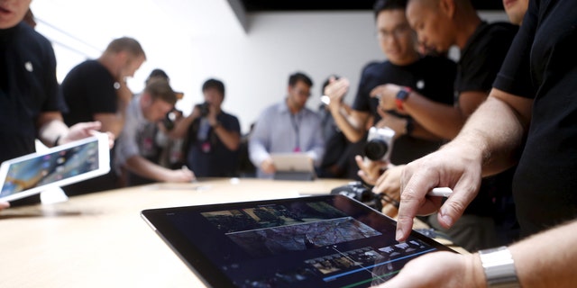 The new Apple iPad Pro is displayed during an Apple media event in San Francisco, Calif., Sept. 9, 2015.