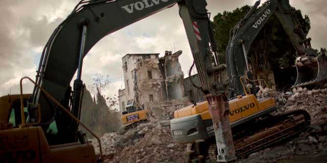 Jan. 9, 2011: Israeli bulldozers demolish the Shepherd Hotel in the east Jerusalrmem neighborhood of Sheik Jarrah. Bulldozers demolished the hotel in an Arab east Jerusalem neighborhood Sunday to make way for a new Israeli enclave, moving ahead with a plan that has angered the Palestinians and the U.S. (AP)