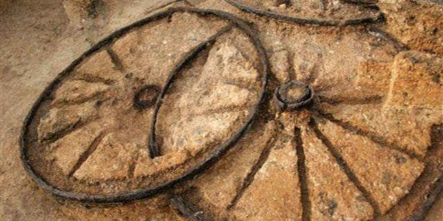 Parts of a different 1,800-year-old bronze chariot, seen, at an ancient Thracian tomb near the village of Karanovo, east of the Bulgarian capital Sofia, Friday, Nov. 21, 2008.