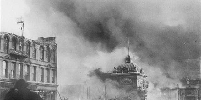 In this April 18, 1906 file picture, smoke rises from out-of-control fires following a powerful earthquake in San Francisco.