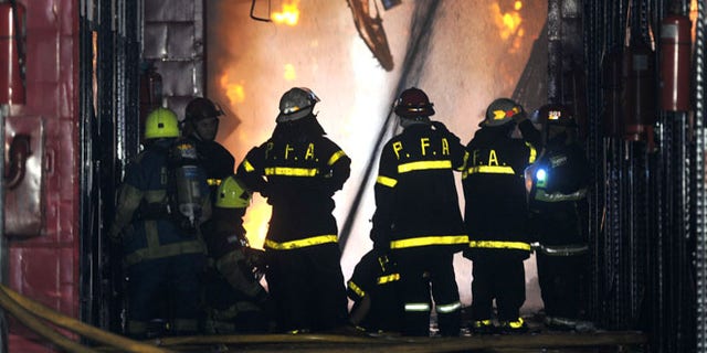 Feb. 5, 2014: Firefighters work to extinguish a fire at the Iron Mountain warehouse in Buenos Aires, Argentina.