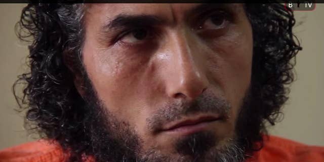 FILE - In this file photo of a frame grab from Barricada TV, recorded on Feb. 11, 2015, Abu Wa’el Dhiab, one of the Syrian refugees released from Guantanamo and now living in Uruguay, speaks during an interview, in Buenos Aires, Argentina. Dhiab, who led hunger strikes as a detainee and was resettled in Uruguay along with five other ex-inmates, is requesting a meeting with Uruguay's foreign minister to talk about the men’s future. The men were resettled in Uruguay in December 2014. (AP Photo/Barricada TV, File)