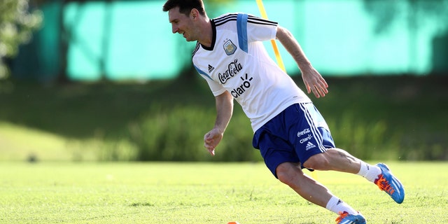 In this picture released by Argentina's Soccer Federation, Lionel Messi trains at Argentina's training facilities in the outskirts of Buenos Aires, Thursday, Dec. 5, 2013. Messi is in Argentina recovering from an injury. (AP Photo/Shu Kitayama,Argentina's Soccer Federation)