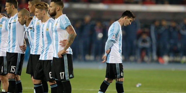 FILE - In this July 4, 2015 file photo, Argentina's Lionel Messi, right, reacts after Argentina's Gonzalo Higuain, missed his penalty kick against Chile during the Copa America final soccer match at the National Stadium in Santiago, Chile. Messi's shocking decision to stop playing for Argentina could further hurt his already tarnished legacy with his national team. If Messi sticks to his announcement, made in the heat-of-the-moment shortly after Argentina's penalty shootout loss to Chile in Sunday's Copa America final on June 26, 2016, Argentina will be left dwelling on the fact that it was not able to win any significant title while having one of the best players of all time. (AP Photo/Ricardo Mazalan, File)