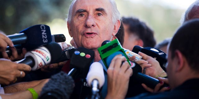 Former Argentine President Fernando de la Rua speaks to the media Monday, Dec. 23, 2013.