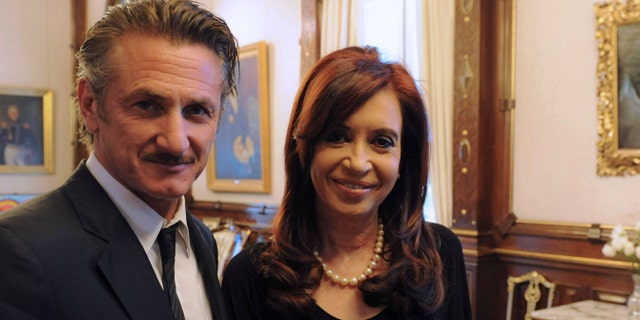 In this picture released by Argentina's Presidency, President Cristina Fernandez poses with actor Sean Penn at government palace in Buenos Aires, Argentina, Monday Feb. 13, 2012. Penn, who is taking Argentina's side in the Falkland Islands dispute, urged Britain to join U.N.-sponsored talks over what he called "the Malvinas Islands of Argentina." (AP Photo/Argentina's Presidency)