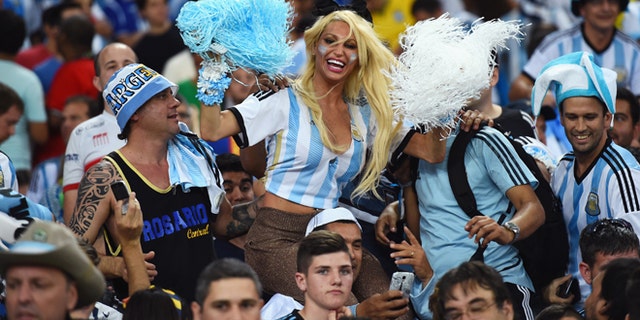 RIO DE JANEIRO, BRAZIL - JUNE 15: An Argentina fan cheers in the crowd prior to the 2014 FIFA World Cup Brazil Group F match between Argentina and Bosnia-Herzegovina at Maracana on June 15, 2014 in Rio de Janeiro, Brazil. (Photo by Matthias Hangst/Getty Images)