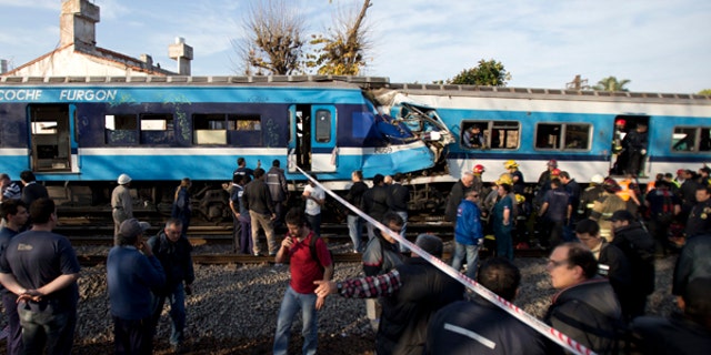 June 13, 2013: Firefighters and rescue workers respond to a fatal commuter train wreck on the outskirts of Buenos Aires, Argentina. A two-level train slammed into another that had stopped between stations during the morning commute Thursday. Firefighters and police are pulling passengers from the wreckage.