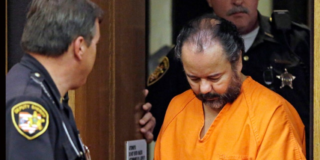 Ariel Castro is led into Cuyahoga County Common Pleas Court in Cleveland for a pretrial hearing on July 3, 2013.