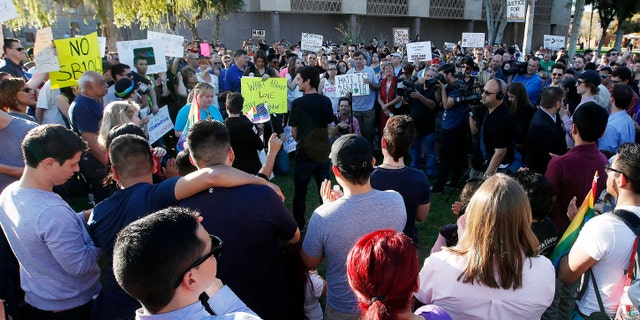 Nearly 250 gay rights supporters protest SB1062 at the Arizona Capitol, Friday, Feb. 21, 2014, in Phoenix.