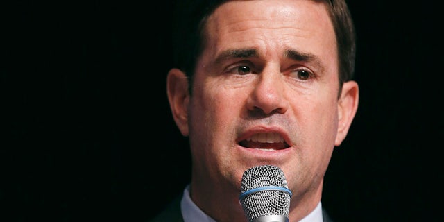FILE - In this July 16, 2014, file photo, Republican gubernatorial candidate Doug Ducey speaks at the 2014 Arizona West Valley Republican Gubernatorial Forum in Glendale. (AP Photo/Ross D. Franklin, File)